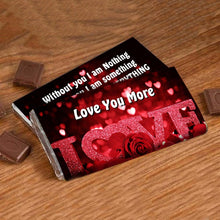 Chocolate bar with romantic text and design on a wooden surface